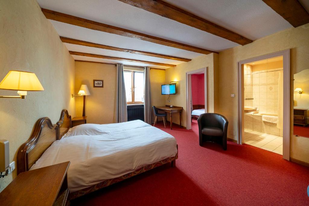 Postel nebo postele na pokoji v ubytování Hôtel A la Vignette - COLMAR-NORD