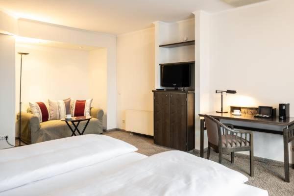 Postel nebo postele na pokoji v ubytování Hotel HerzogsPark