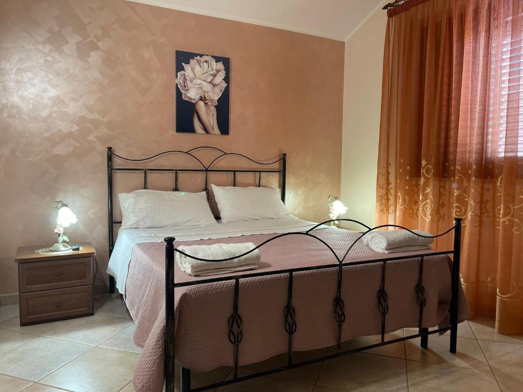 Łóżko lub łóżka w pokoju w obiekcie VILLA ANNA MARIA