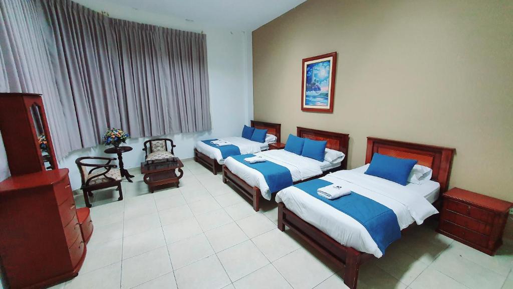 Postel nebo postele na pokoji v ubytování Meraki Hotel