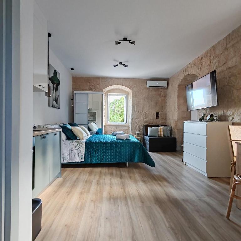 TV a/nebo společenská místnost v ubytování Studio Apartment Maria