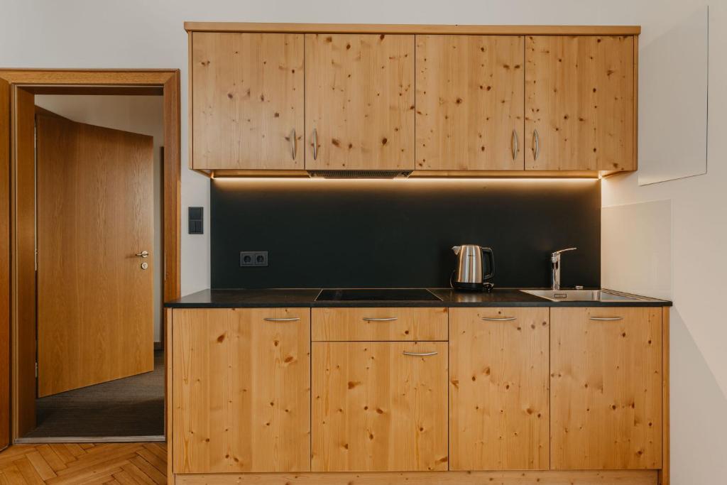 Kuchyň nebo kuchyňský kout v ubytování Hotel Garni Planaces