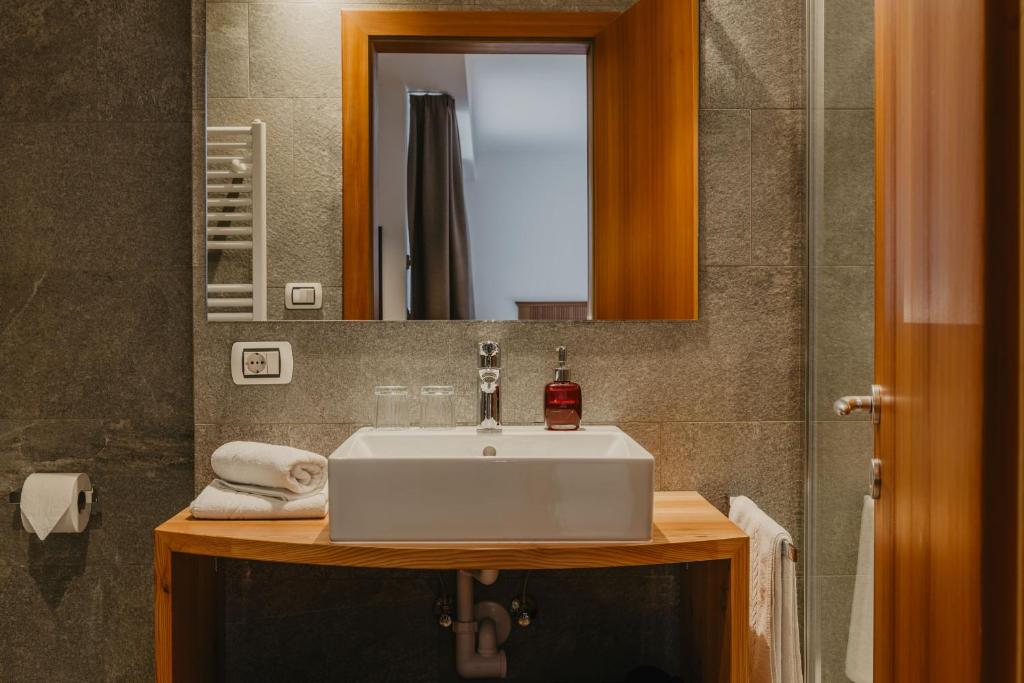 Koupelna v ubytování Hotel Garni Planaces