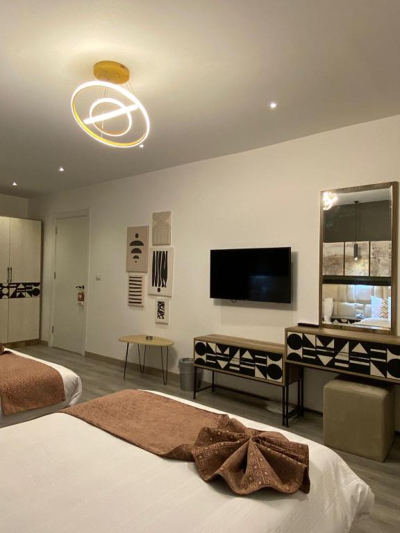 TV a/nebo společenská místnost v ubytování Elite Pyramids Boutique Hotel