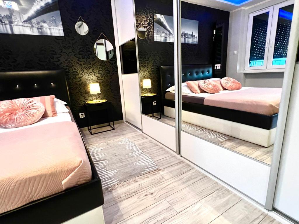 Posteľ alebo postele v izbe v ubytovaní Spółdzielcza 22 Apartament Sky Line
