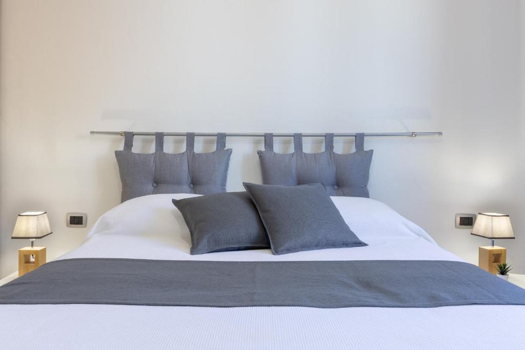 A bed or beds in a room at Max Apartment
