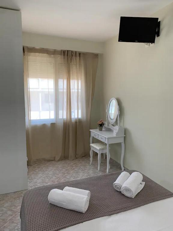 Postel nebo postele na pokoji v ubytování Apartment near Piraeus port