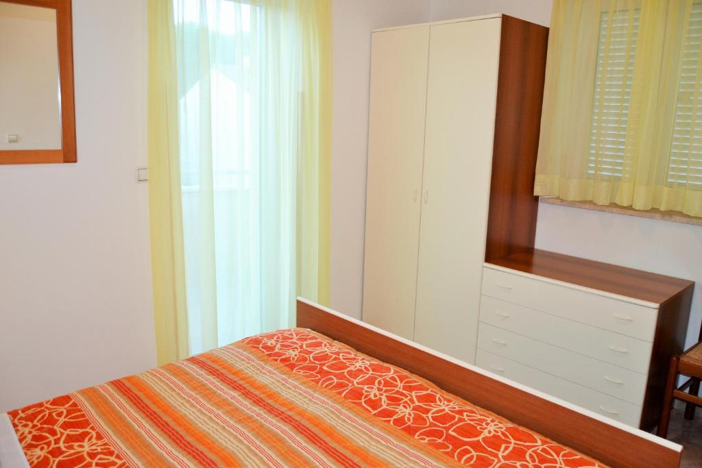 Postel nebo postele na pokoji v ubytování Apartments Tanja
