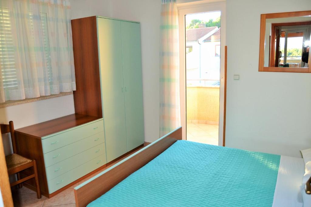 Postel nebo postele na pokoji v ubytování Apartments Tanja