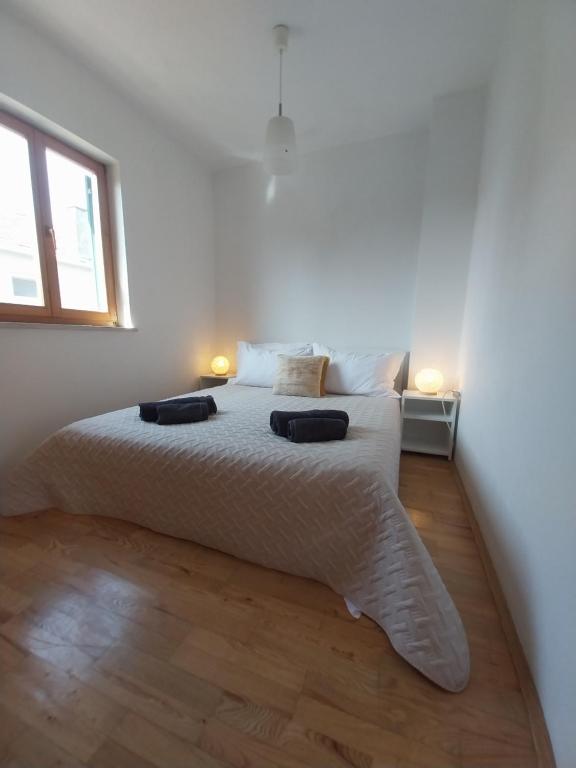 Postel nebo postele na pokoji v ubytování Apartments Miodrag