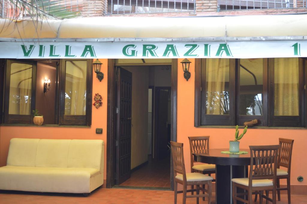 a building with a sign that reads villa graza at Villa Grazia in Aci Catena