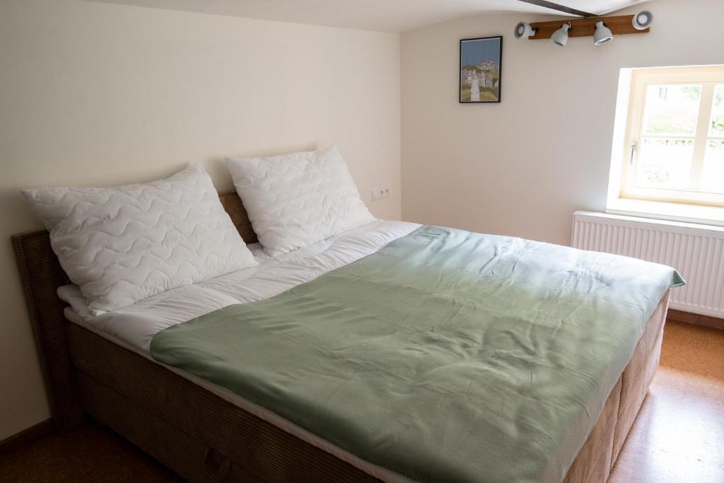 Postel nebo postele na pokoji v ubytování Apartmány Josefův Důl - Lesní Brána