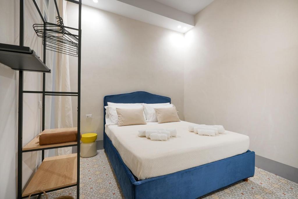 Letto o letti in una camera di Mimi's Rooms - Charming Old Town