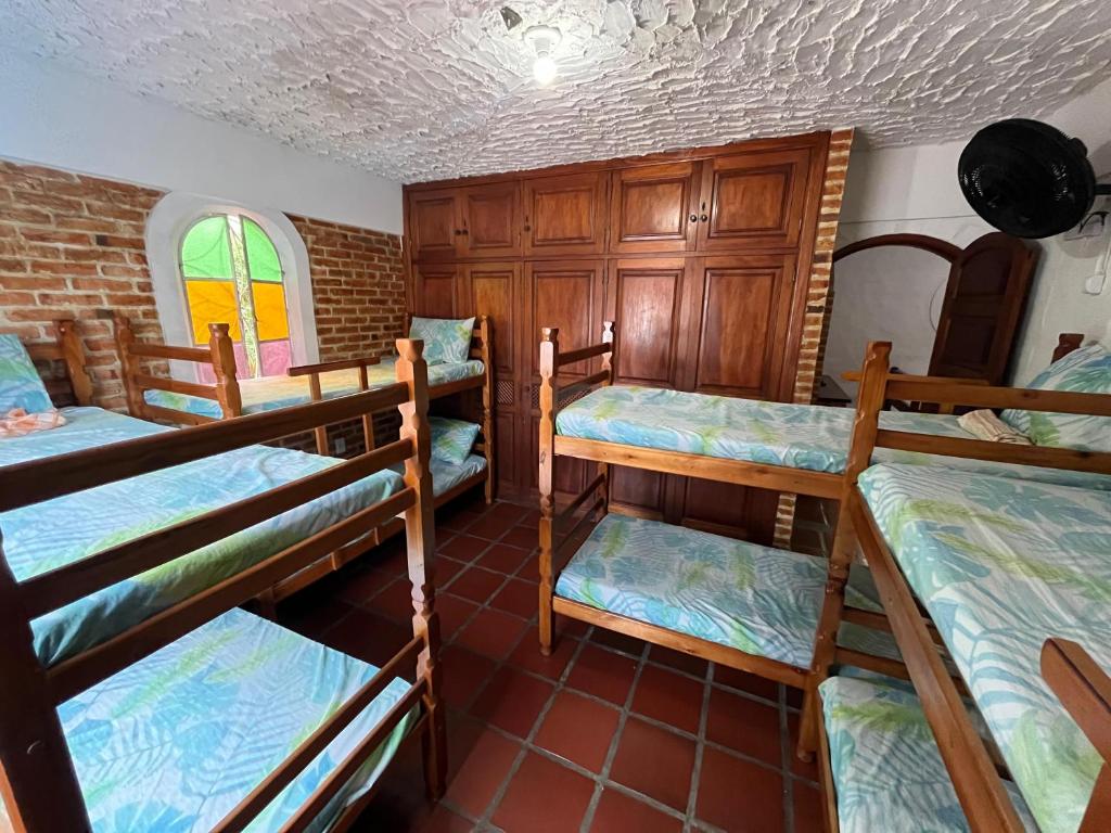 Cama ou camas em um quarto em Aloha Hostel CF