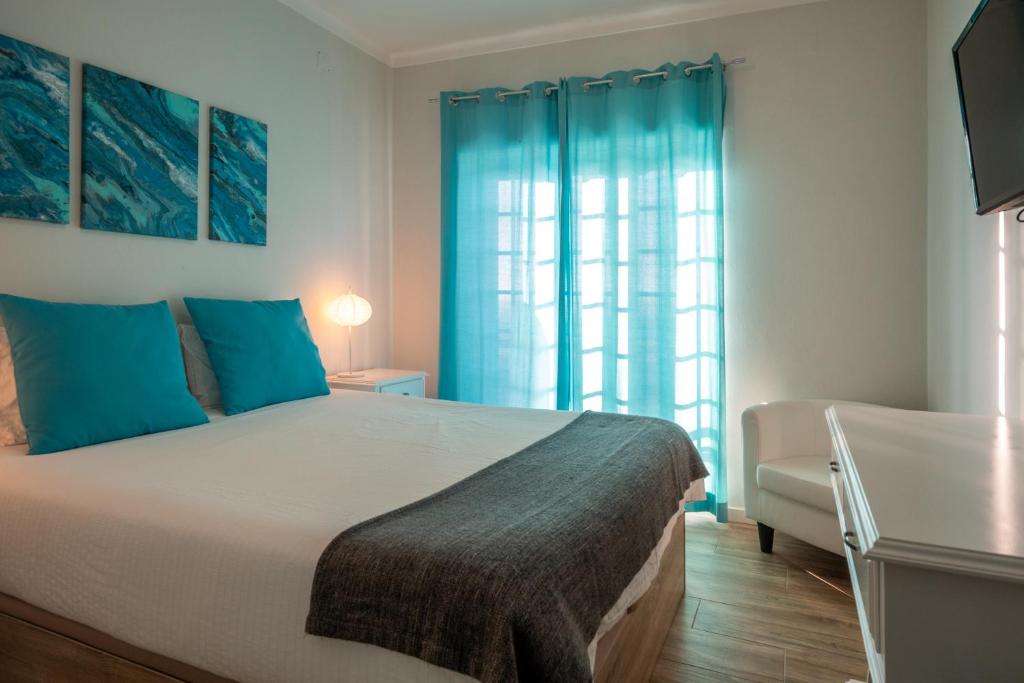 Ένα ή περισσότερα κρεβάτια σε δωμάτιο στο EnSuite 1 Azul Rochedo