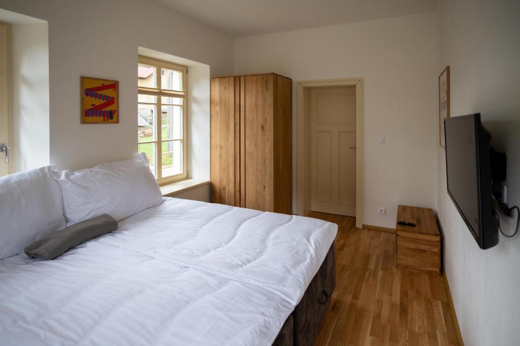Postel nebo postele na pokoji v ubytování Apartmány Josefův Důl - Lesní Brána