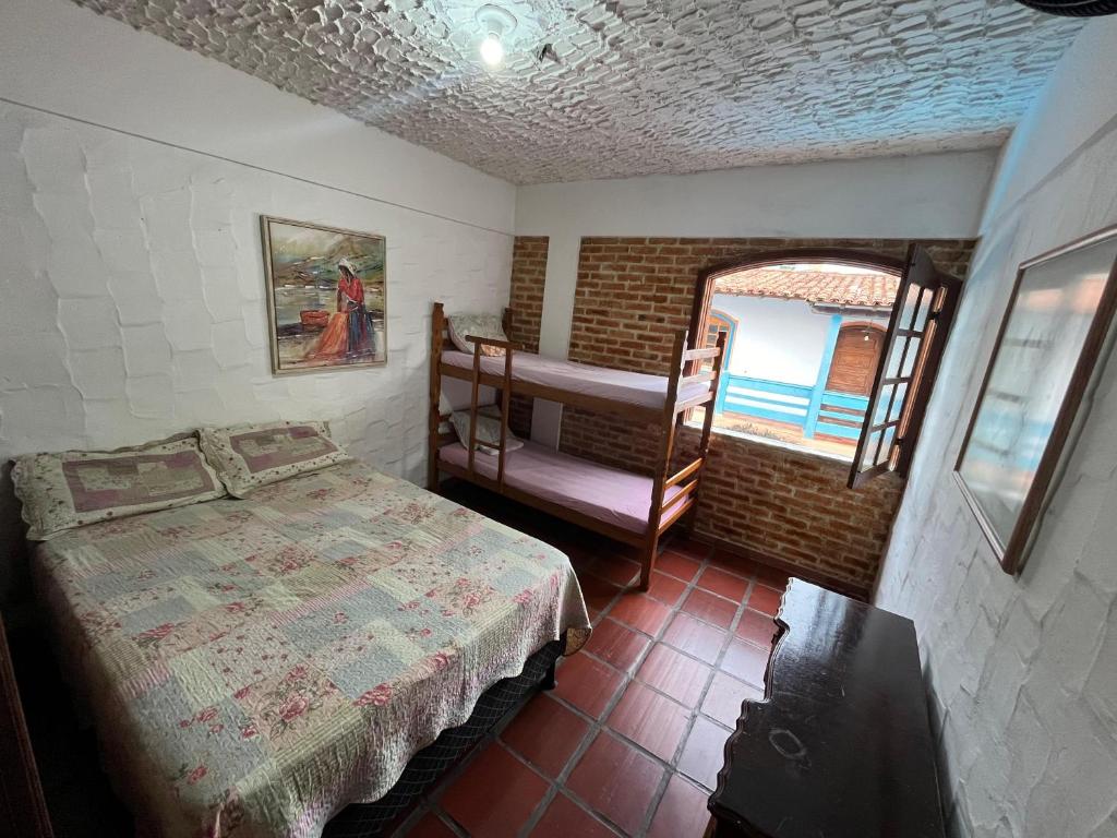 Cama ou camas em um quarto em Aloha Hostel CF