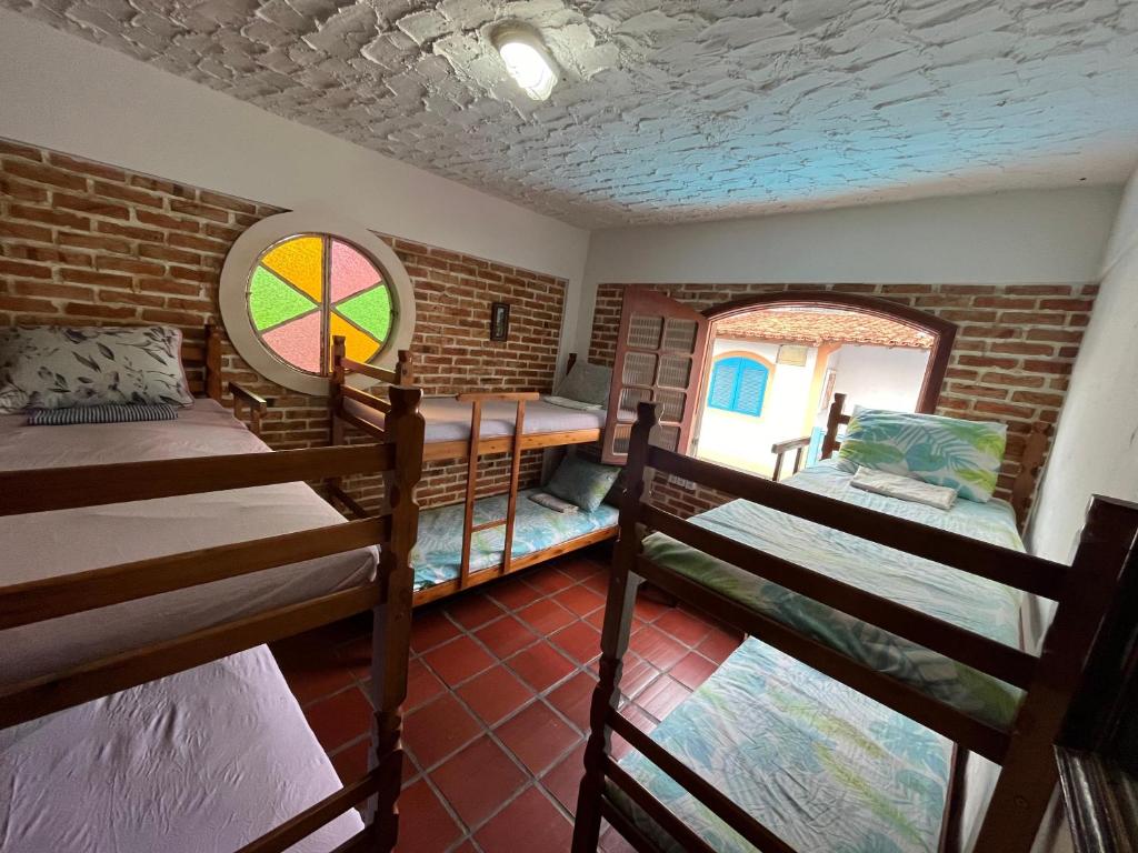Cama ou camas em um quarto em Aloha Hostel CF