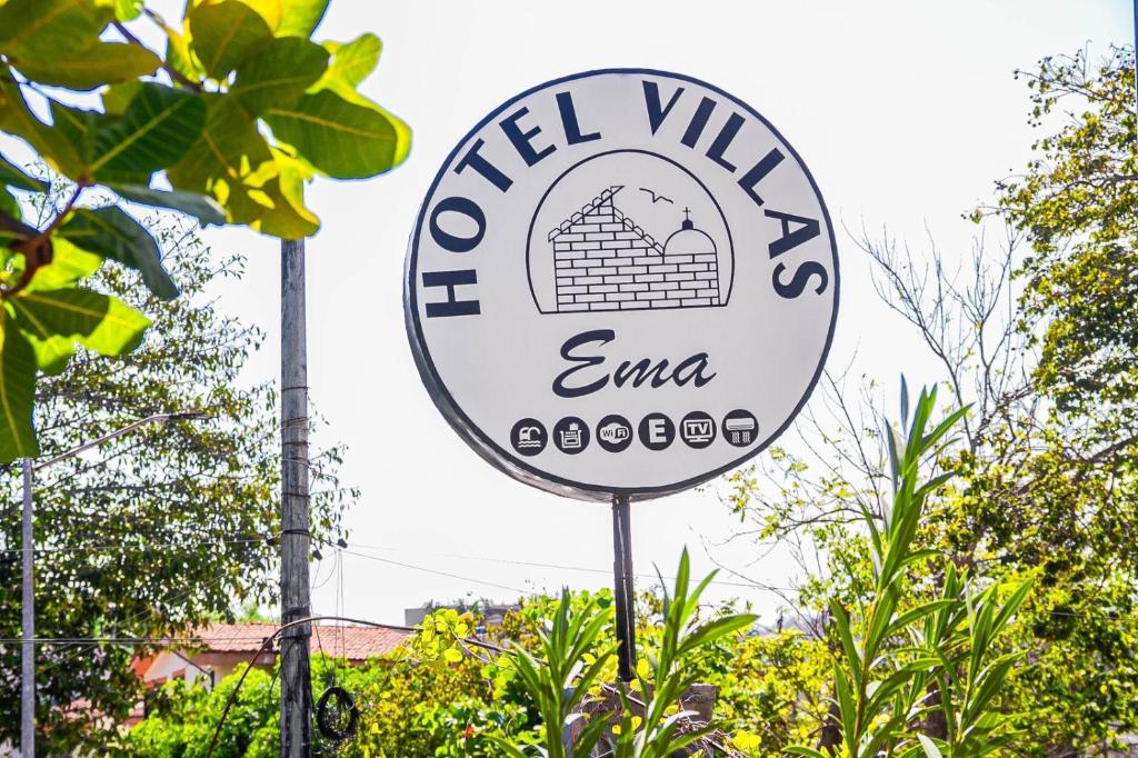 a sign for a mill village ema at Hotel Villas Ema in Zihuatanejo