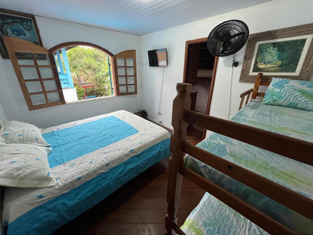 Cama ou camas em um quarto em Aloha Hostel CF