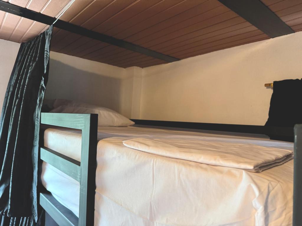 Postel nebo postele na pokoji v ubytování Maracuya Hostel