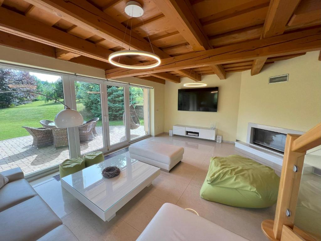 a living room with a couch and a table at Drevenica Nela - Chalet in Tatras in Zuberec