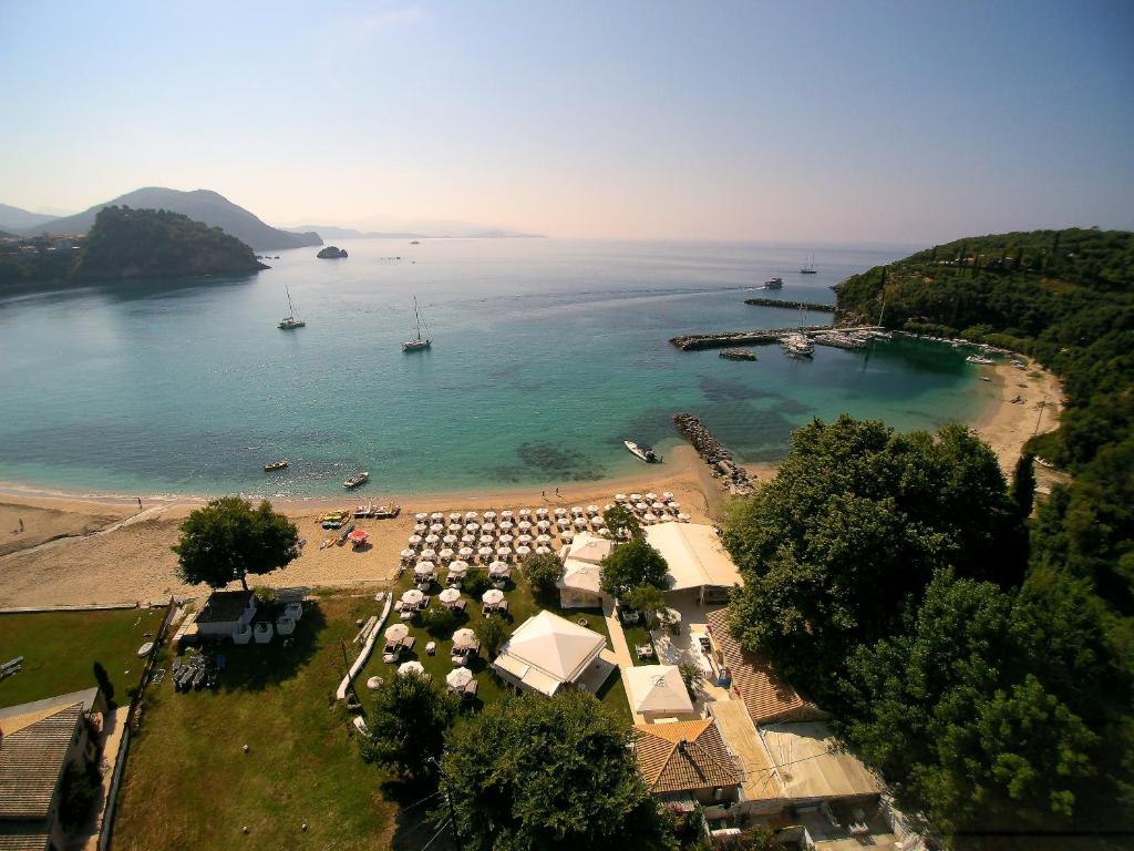 an aerial view of a beach with a group of umbrellas at Cape North West in Parga