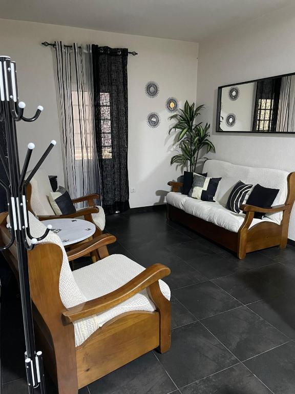 a living room with a couch and a table at Alojamento Local Afonso in Macedo de Cavaleiros