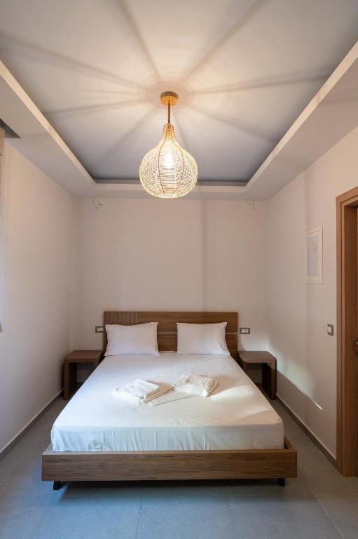 Postel nebo postele na pokoji v ubytování Raptis Apartments