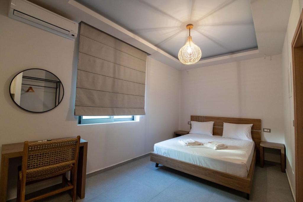 Postel nebo postele na pokoji v ubytování Raptis Apartments