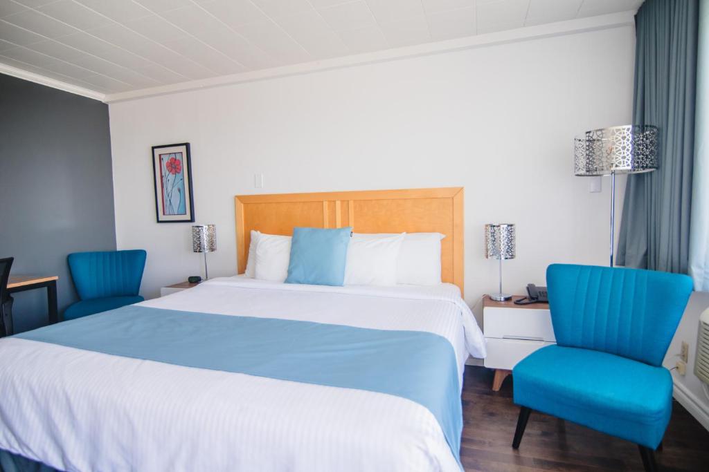 Una cama o camas en una habitación de Riôtel Carleton-sur-Mer