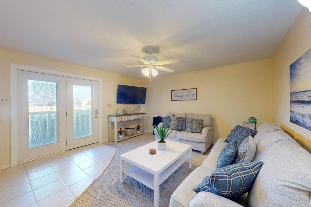 a living room with a couch and a table at Marathon North 101 in Ocean City