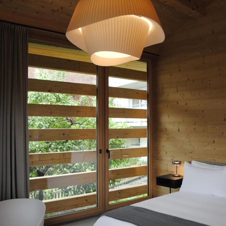 Postel nebo postele na pokoji v ubytování Boutique Hotel Casa Giovanoli