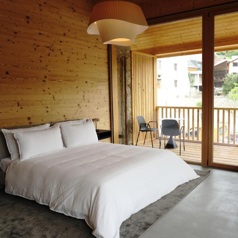 Postel nebo postele na pokoji v ubytování Boutique Hotel Casa Giovanoli