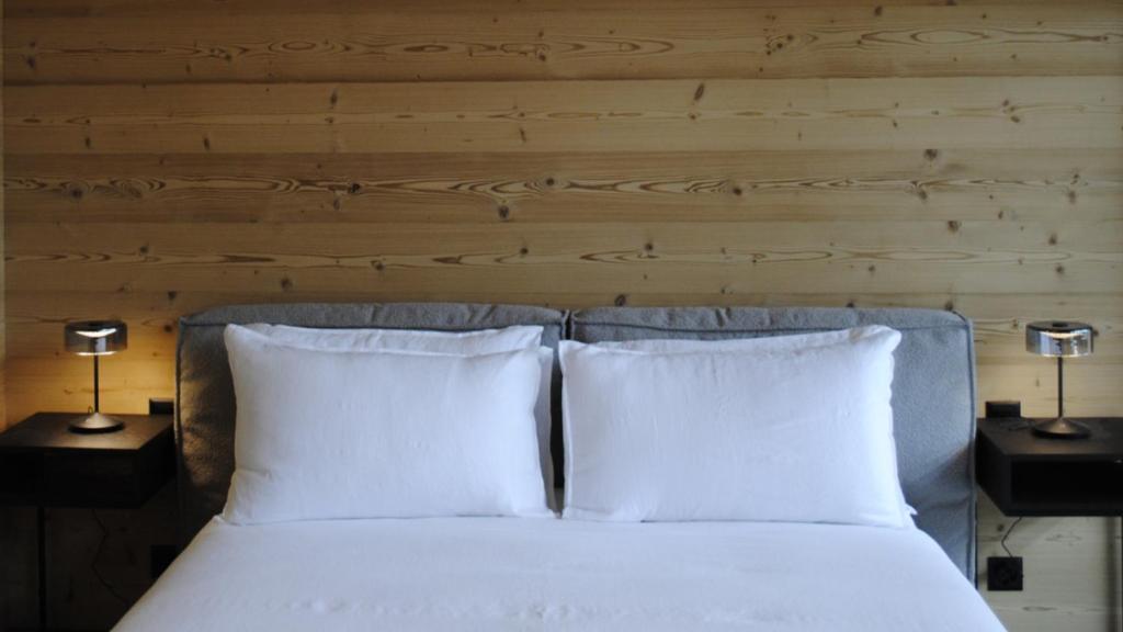 Postel nebo postele na pokoji v ubytování Boutique Hotel Casa Giovanoli
