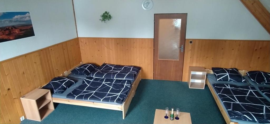 Postel nebo postele na pokoji v ubytování Penzion Athena