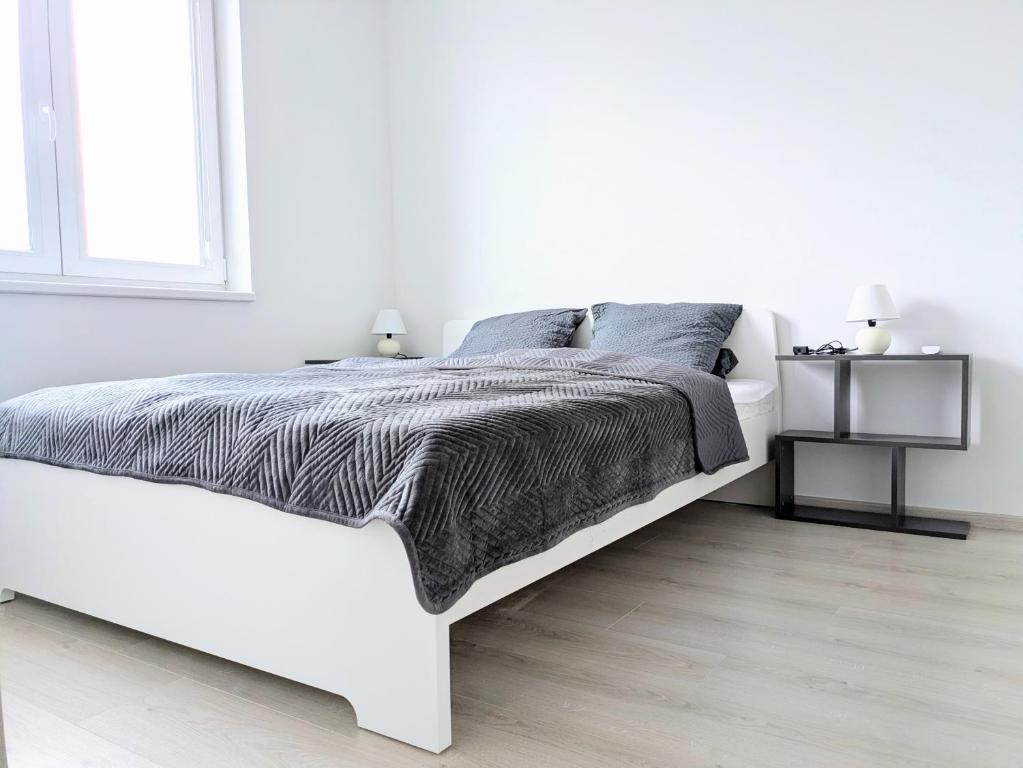 Postel nebo postele na pokoji v ubytování Apartman Amanda - Ohrada