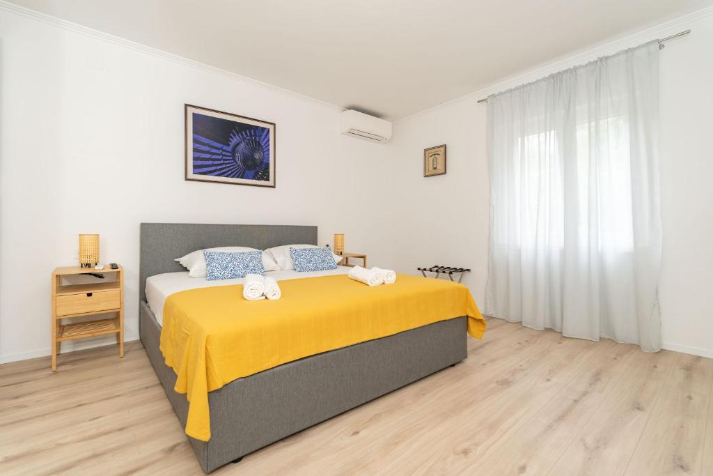 Postel nebo postele na pokoji v ubytování Villa Three Olives