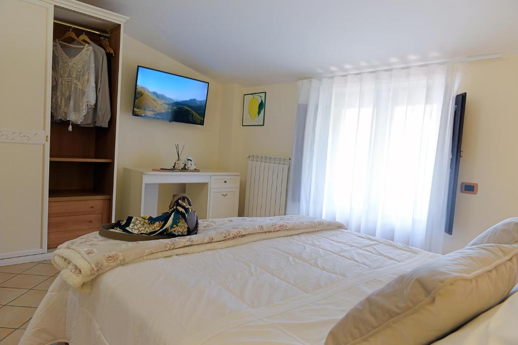 Postel nebo postele na pokoji v ubytování Agriturismo Il Tintore