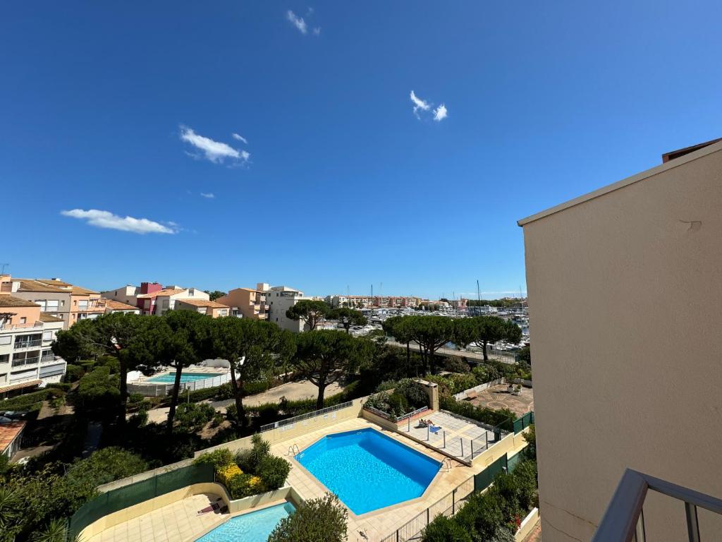 a view of a swimming pool from a building at T1 Cap D'Agde piscine Port in Cap d'Agde