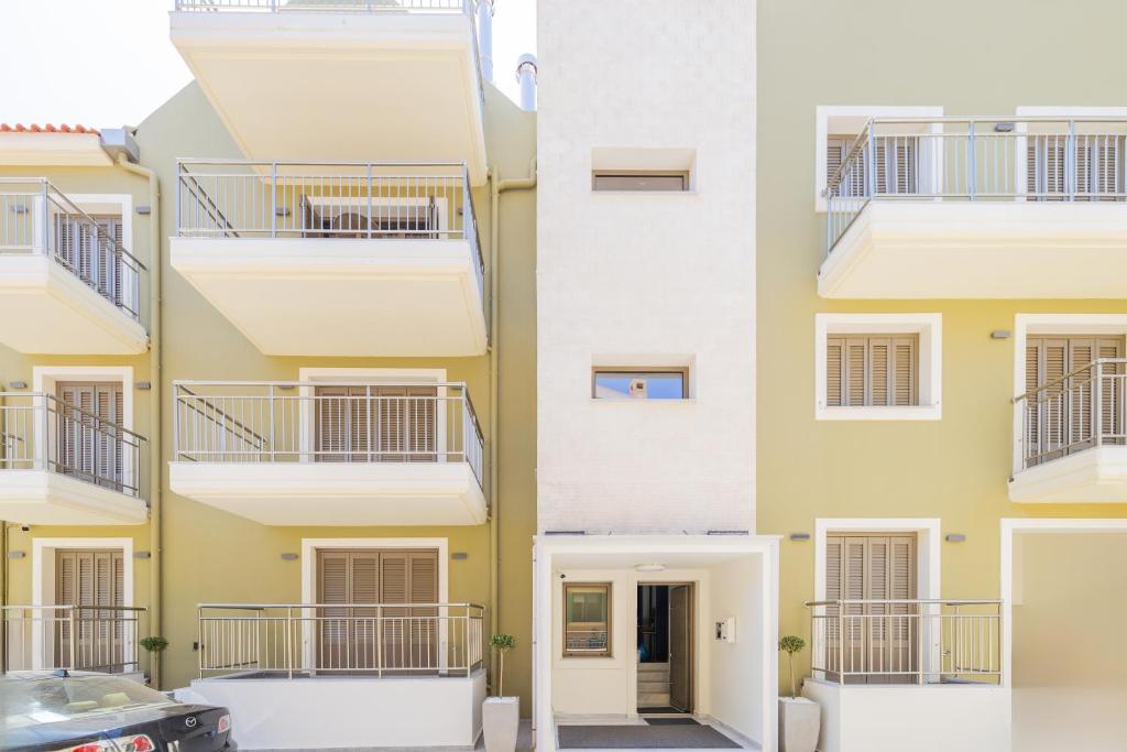 a facade of a building with balconies at AM Suites Kefalonia in Argostoli
