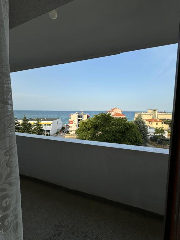 a large window in a room with a view of the ocean at obzor, orkinos in Obzor