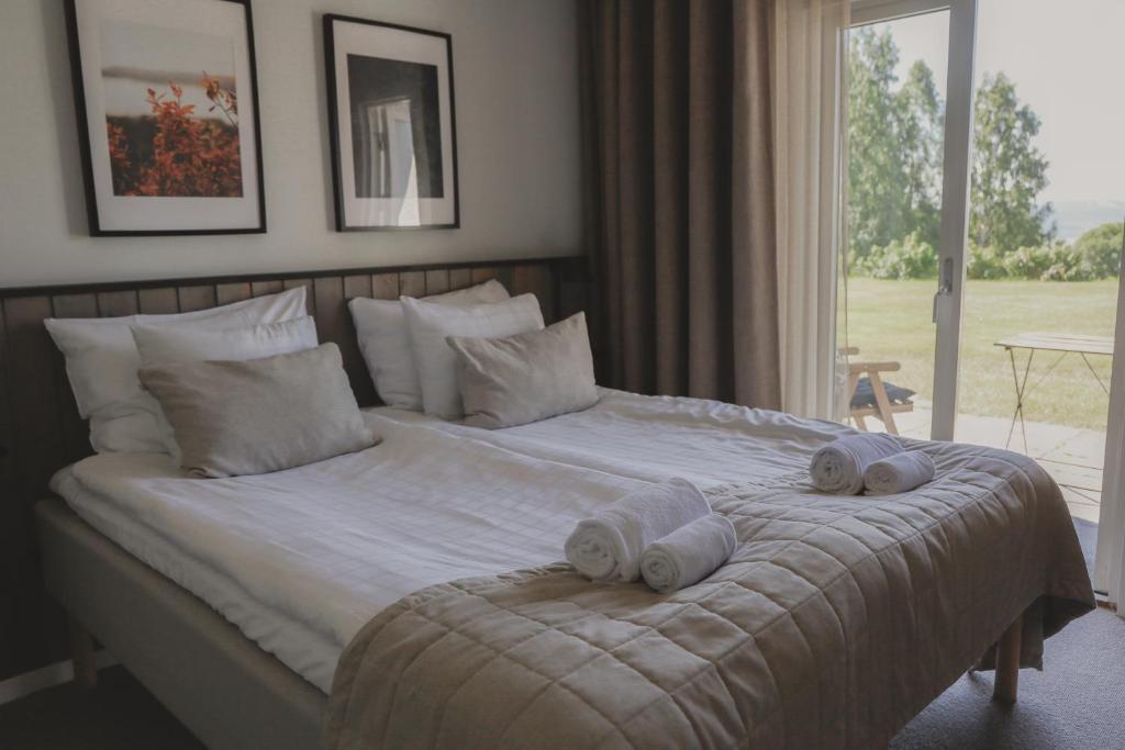 Postel nebo postele na pokoji v ubytování Siljansnäs Hotell