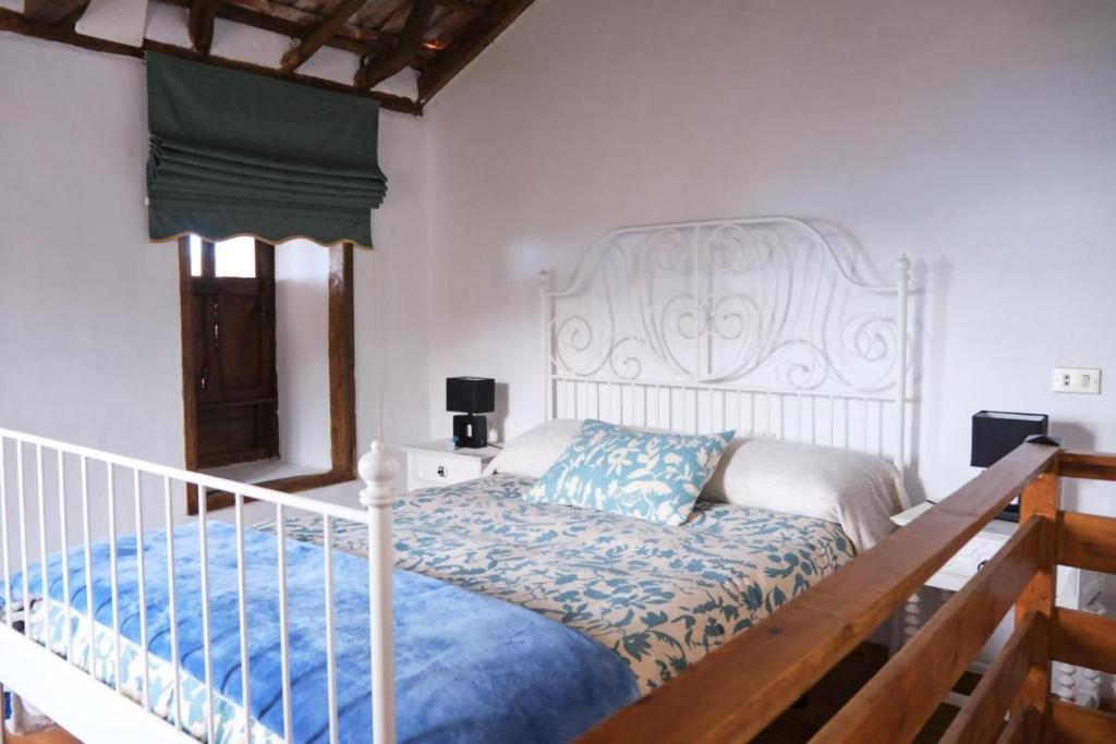 Postel nebo postele na pokoji v ubytování Casa Rural Felipe Luis