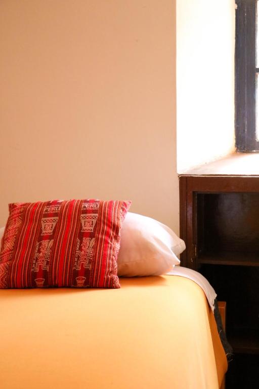 Postel nebo postele na pokoji v ubytování Millas House Cusco
