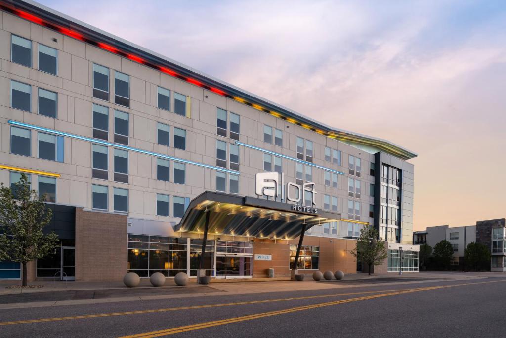 an office building with a sign on it at Aloft by Marriott Broomfield Denver in Broomfield