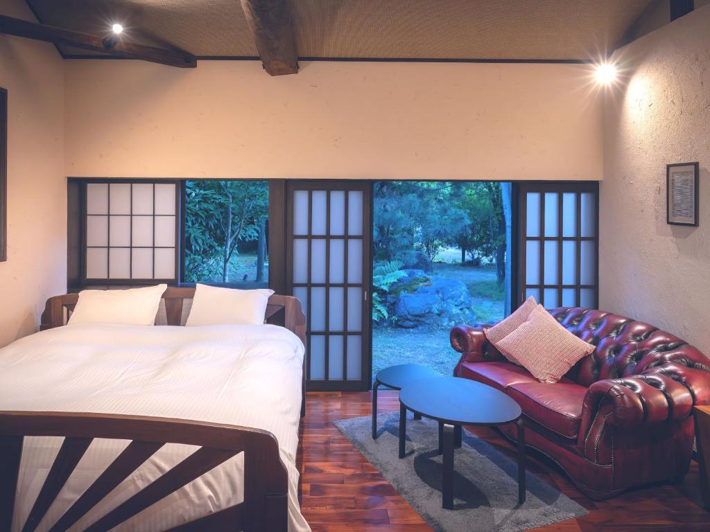 Postel nebo postele na pokoji v ubytování Machiya Hotel oyado baison
