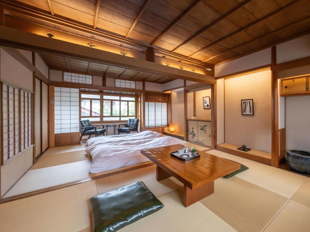 Postel nebo postele na pokoji v ubytování Machiya Hotel oyado baison