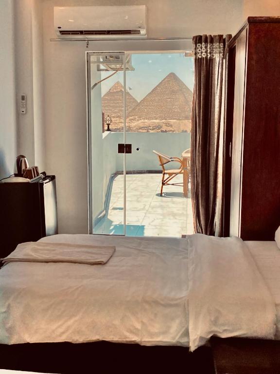 Llit o llits en una habitació de Anubis Pyramids View