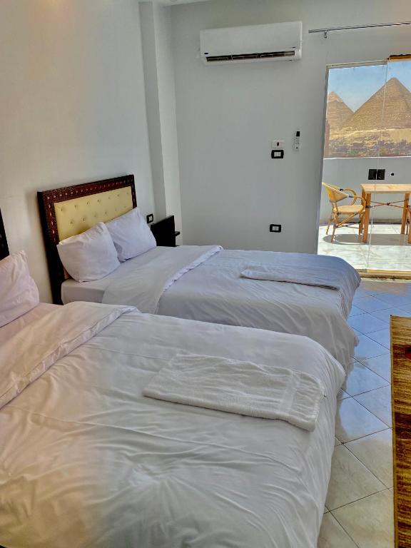 Llit o llits en una habitació de Anubis Pyramids View